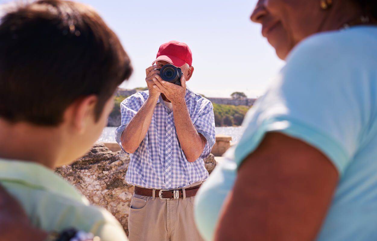 Family On Holidays In Cuba Grandpa Tourist Taking Photo